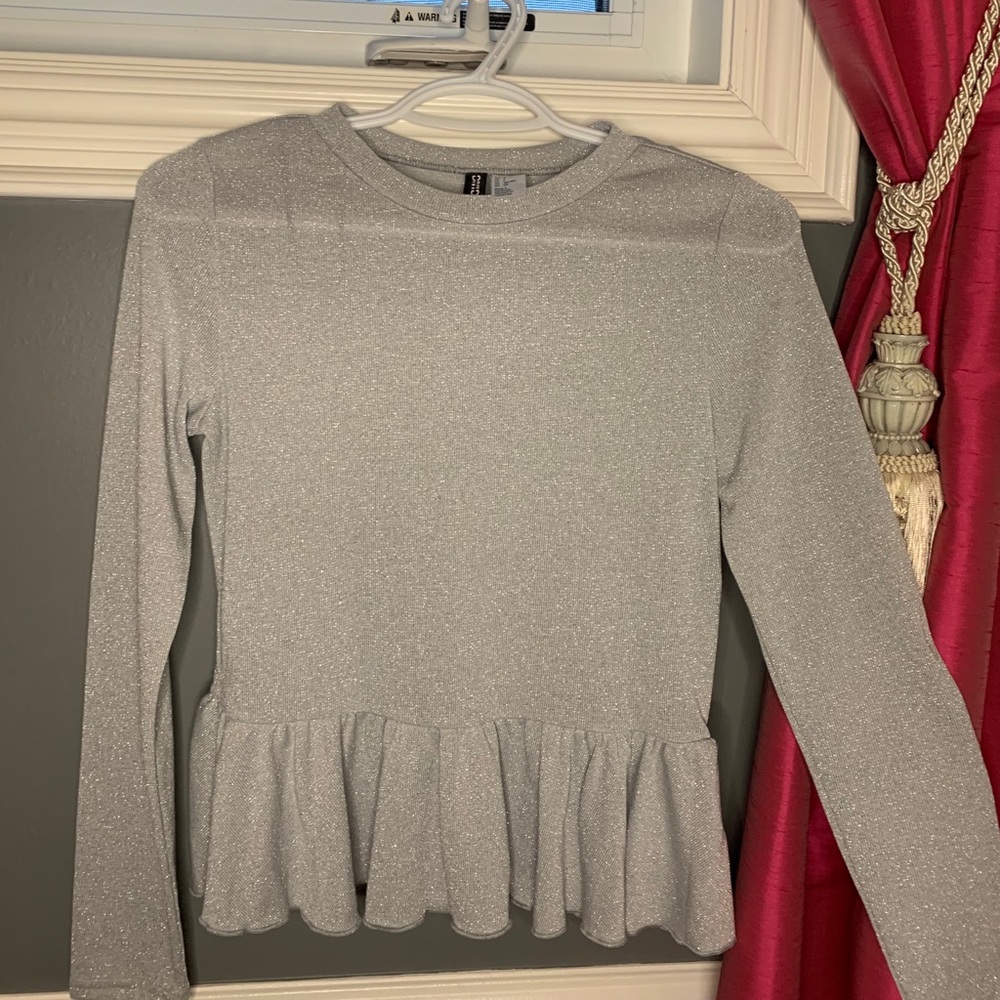 Sparkly long sleeve peplum top